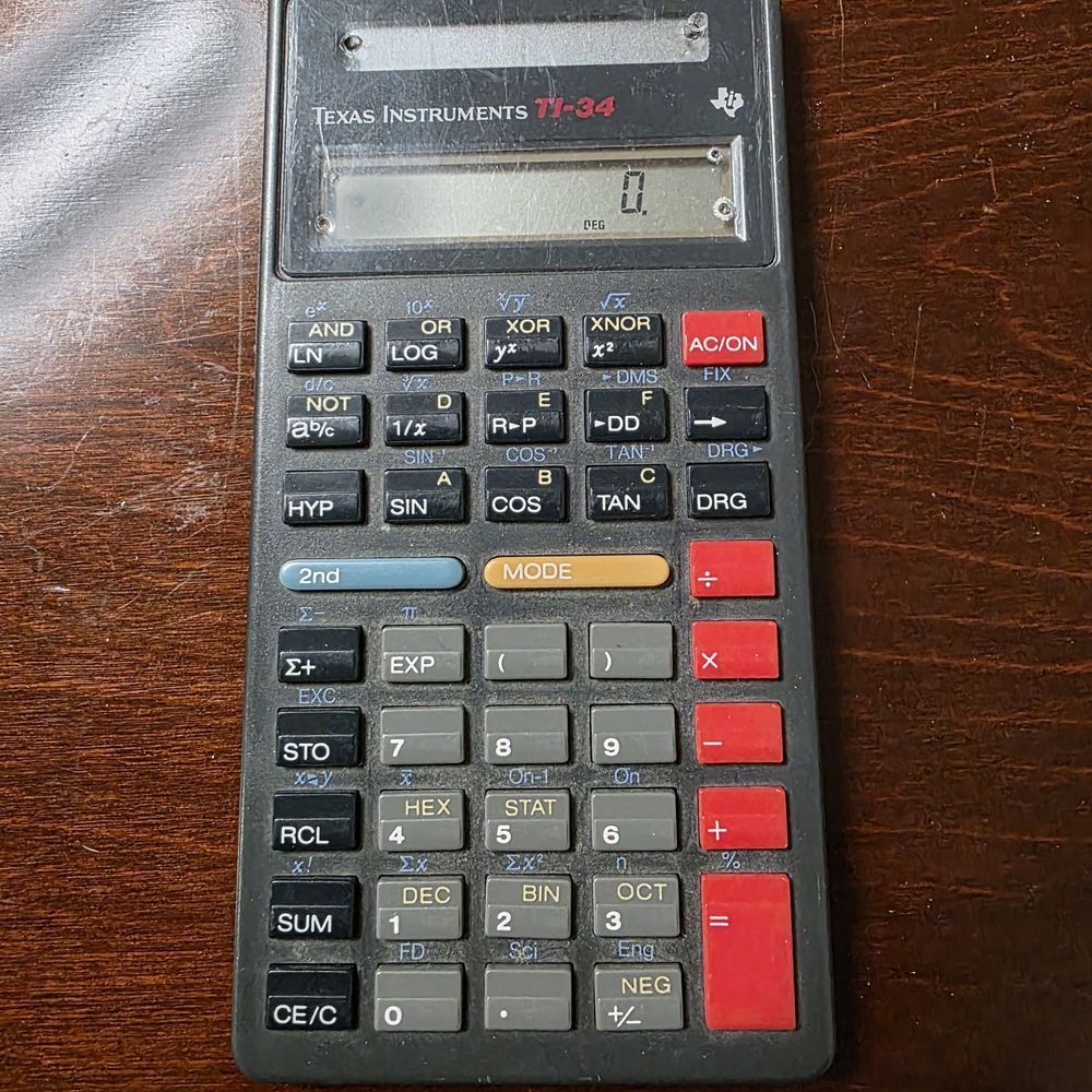 Texas Instruments TI-34 Calculator - Black with Red and Gray Accents